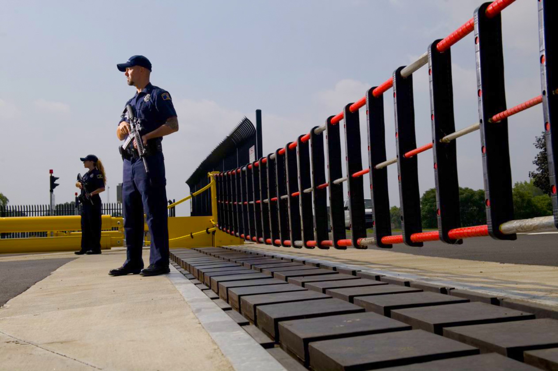 GRAB-350 net barrier across a guarded checkpoint lane